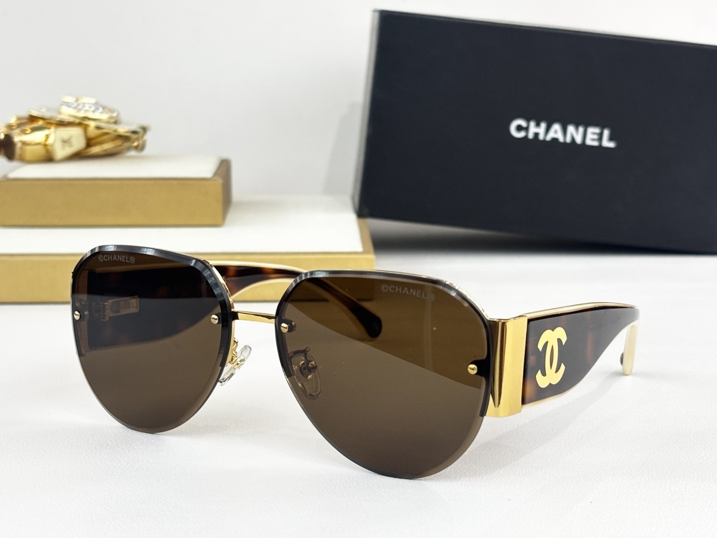 Chanel Luxury Rimless Aviator Sunglasses with CC Logo Temples