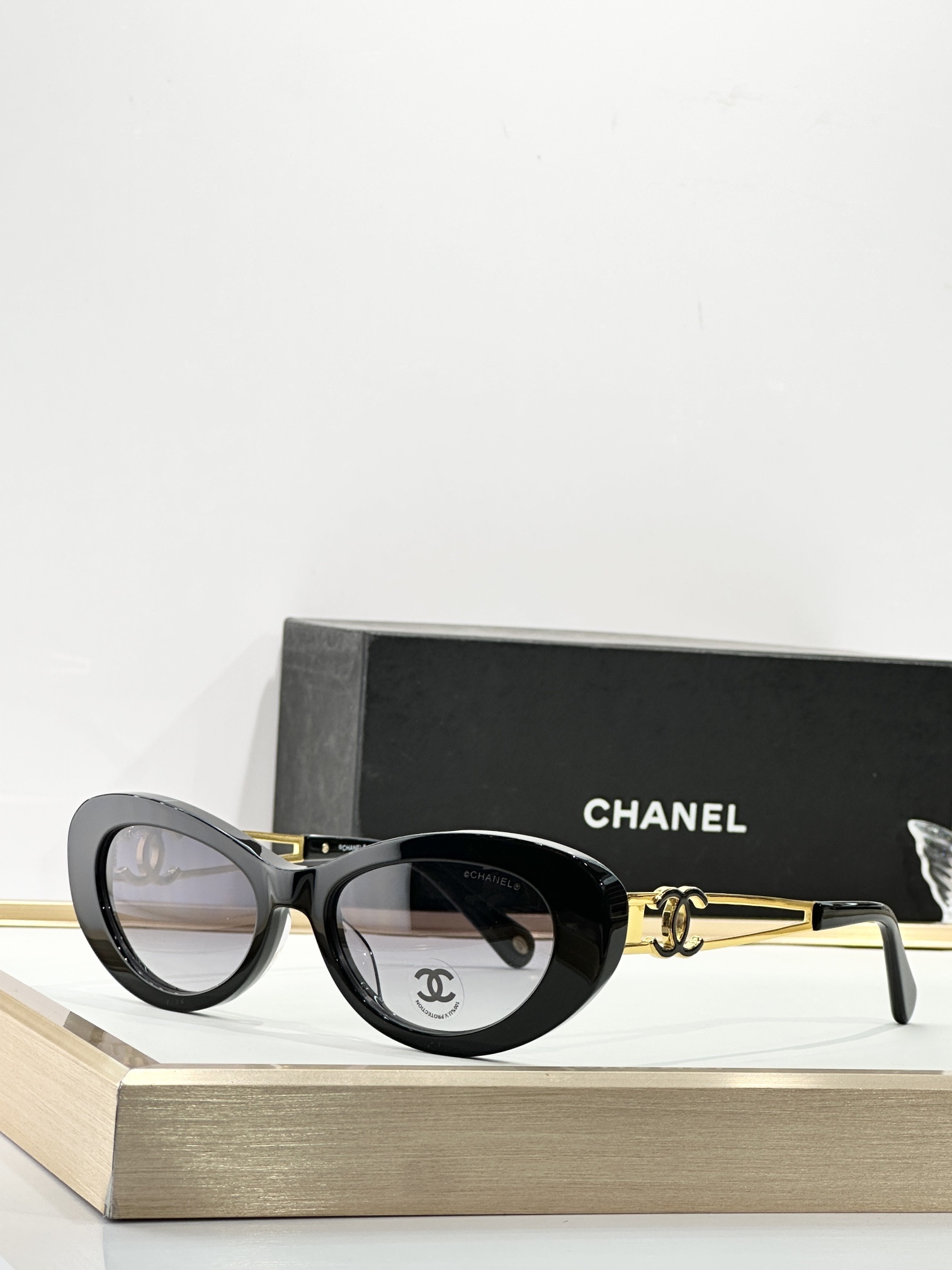 Chanel Oval Sunglasses – Black Acetate with Gold CC Logo Temples
