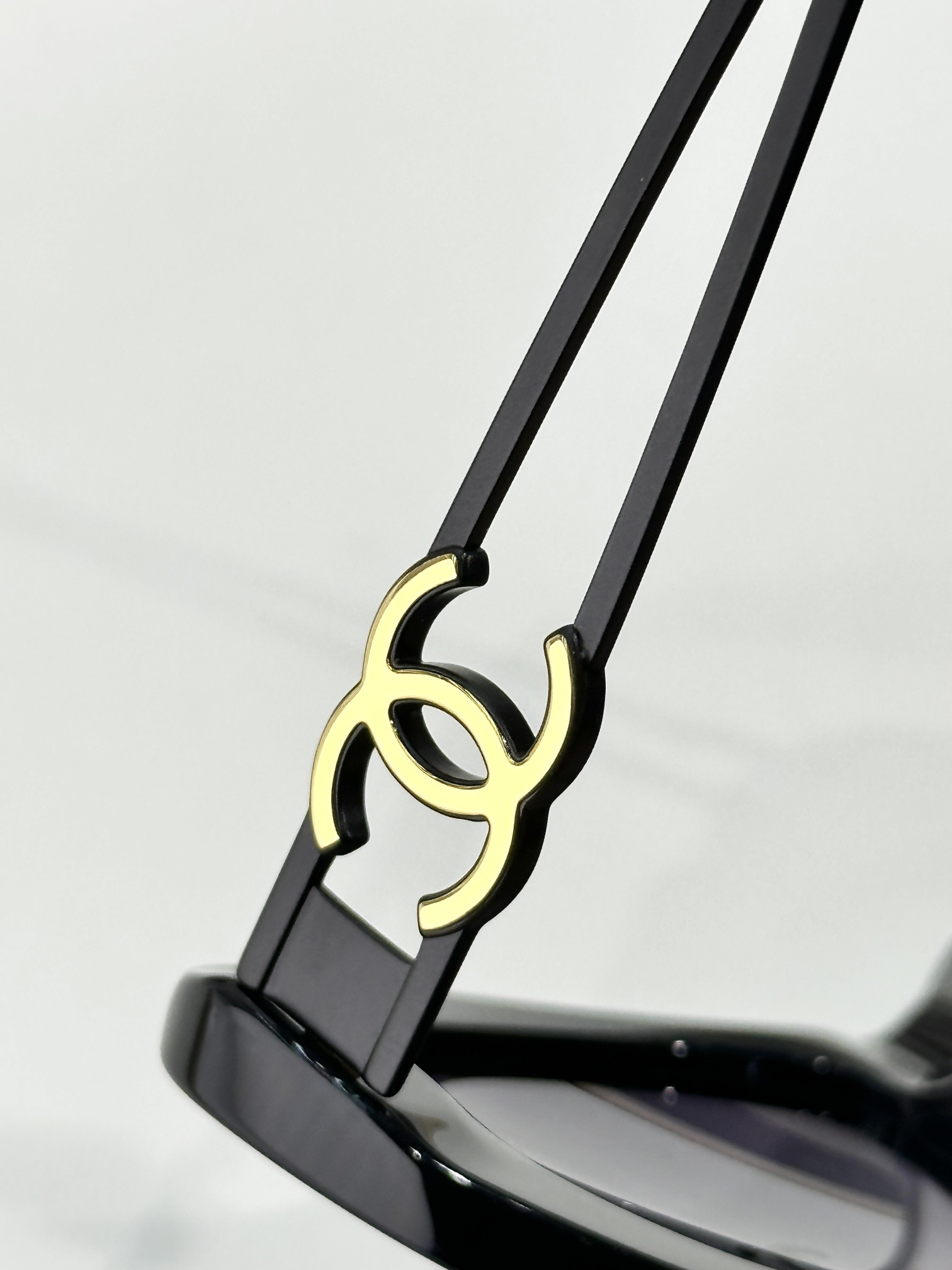 Chanel Oval Sunglasses – Black Acetate with Gold CC Logo Temples