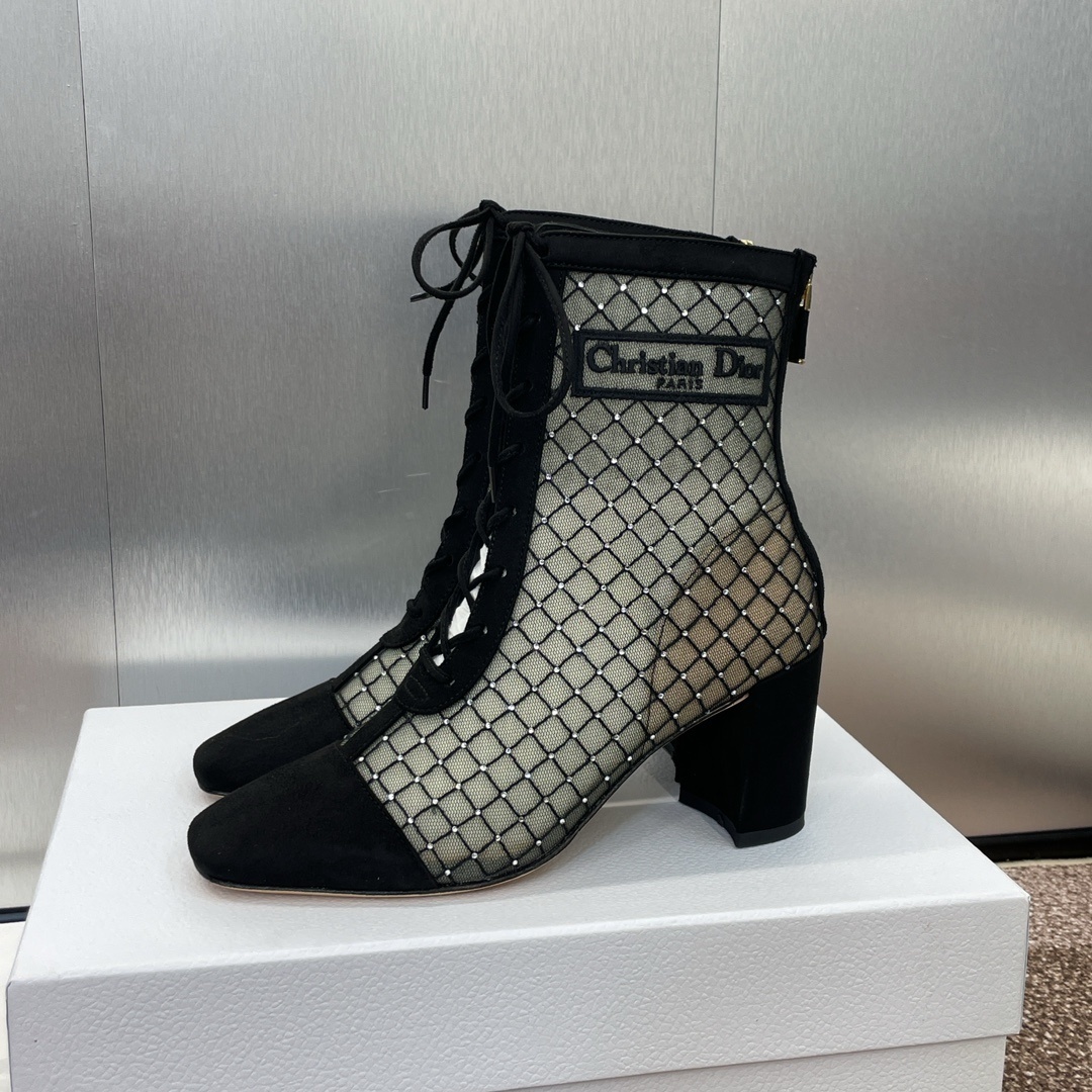 Christian Dior D-Fight black mesh ankle boots with crystal grid pattern, lace-up front, and block heel on a white display box.