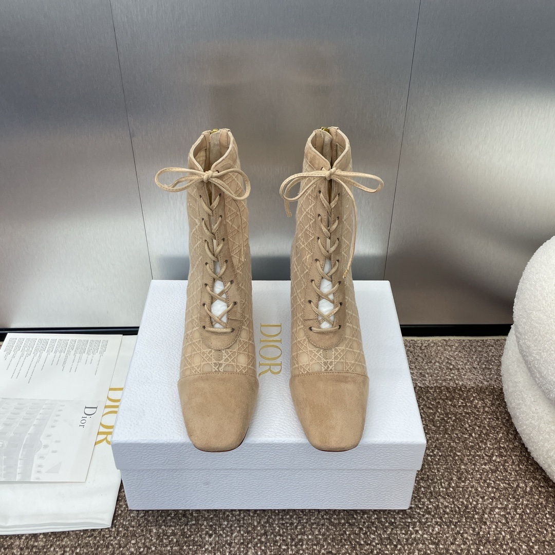 A pair of Dior nude mesh lace-up ankle boots with Cannage embroidery and block heels, presented on a white Dior box.
