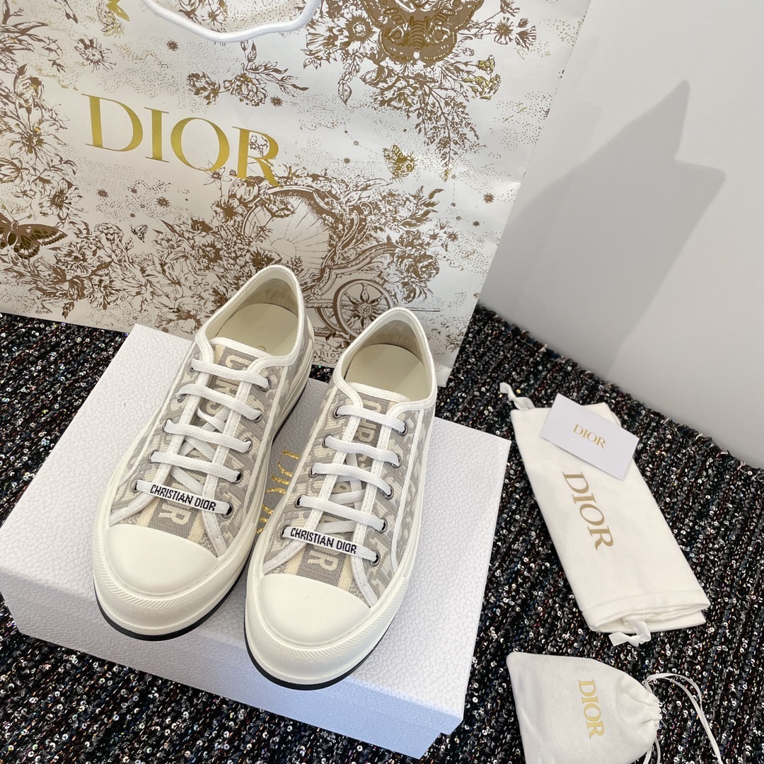 Pair of Dior Walk'n'Dior sneakers in gray Oblique embroidered cotton with white laces, Dior box, and dust bags.