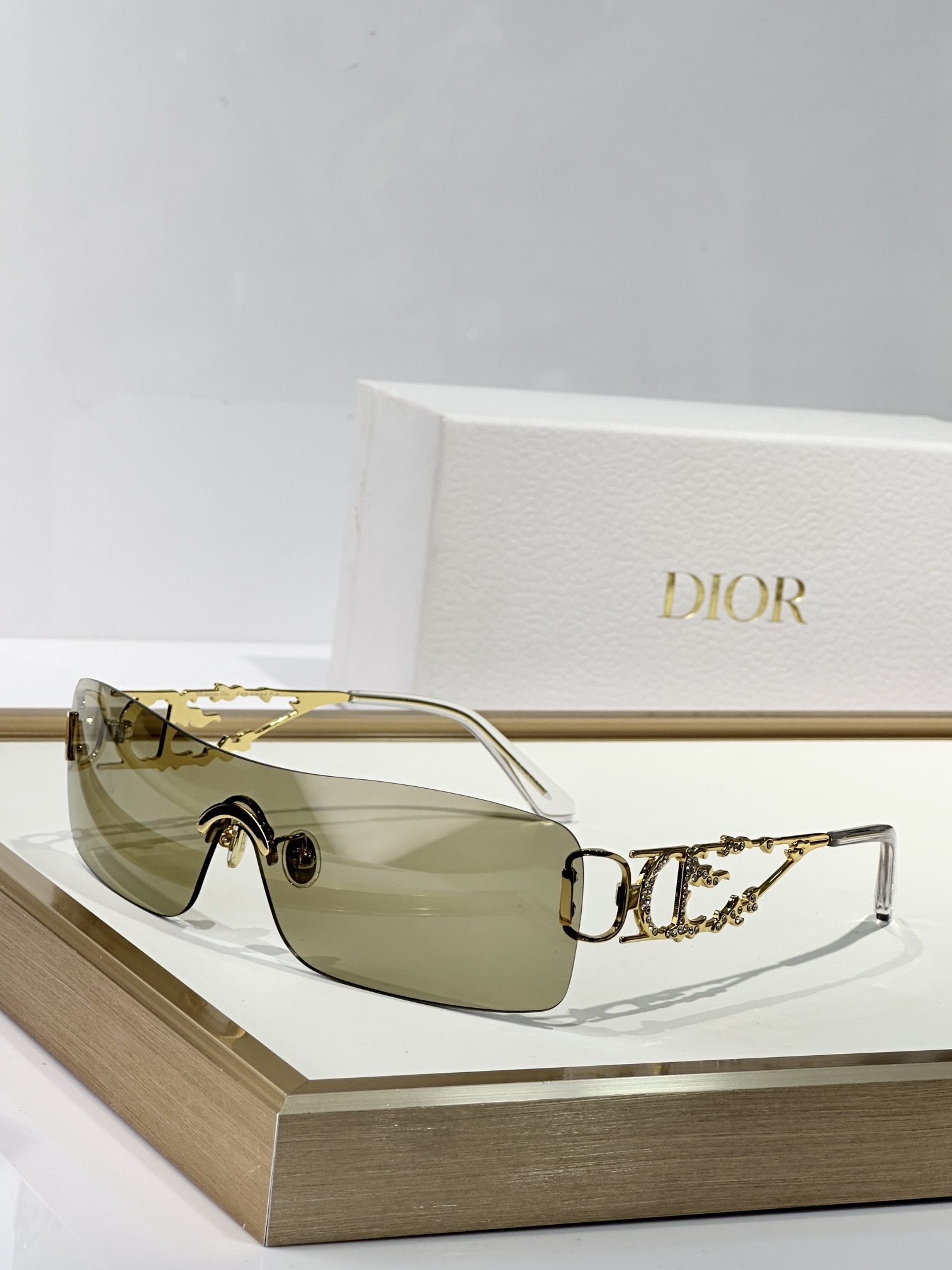 Dior Beige Rimless Sunglasses – Gold Floral Details
