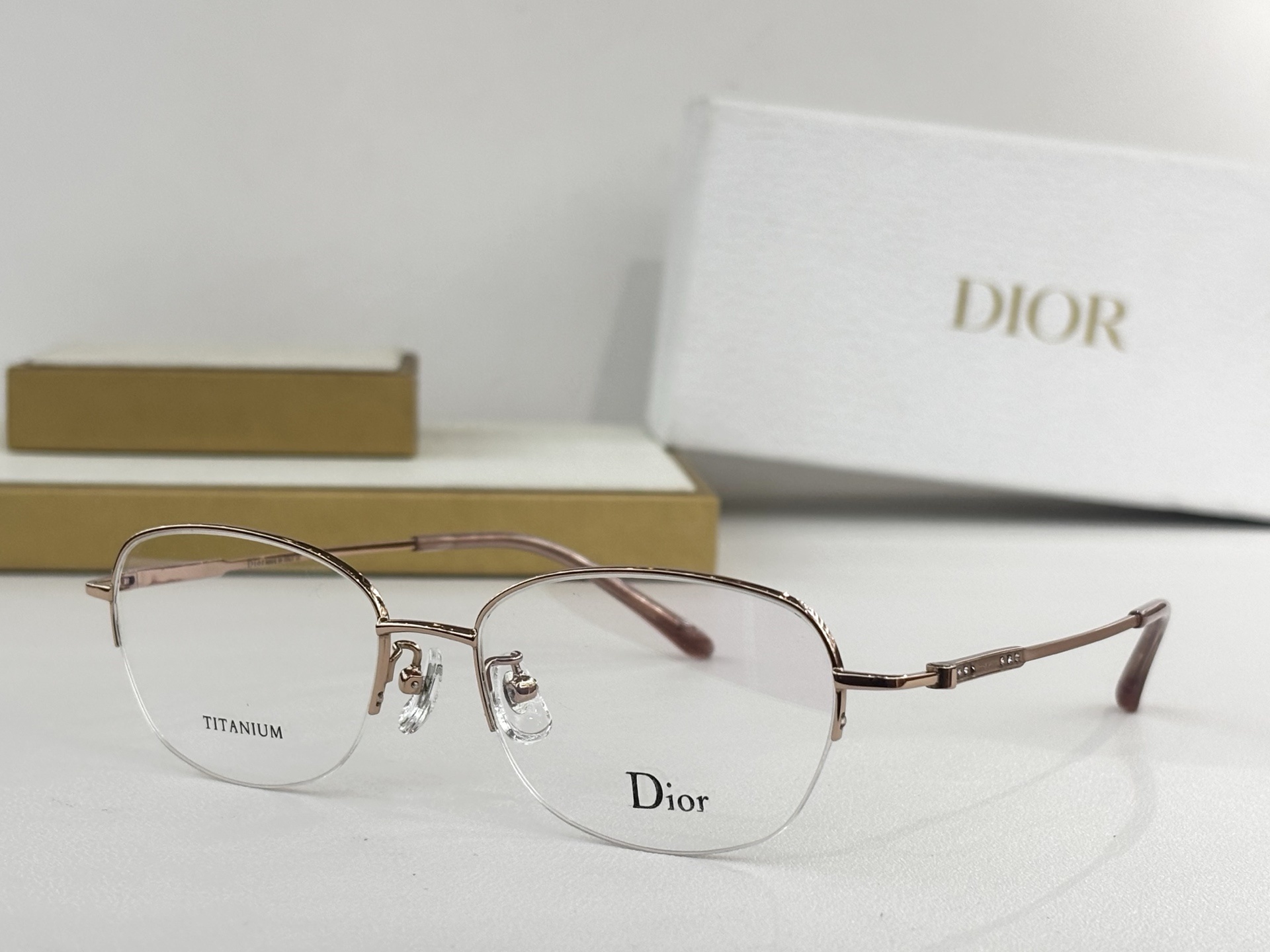 Dior Titanium Luxury Half-Rim Eyeglasses – Elegant Rose Gold
