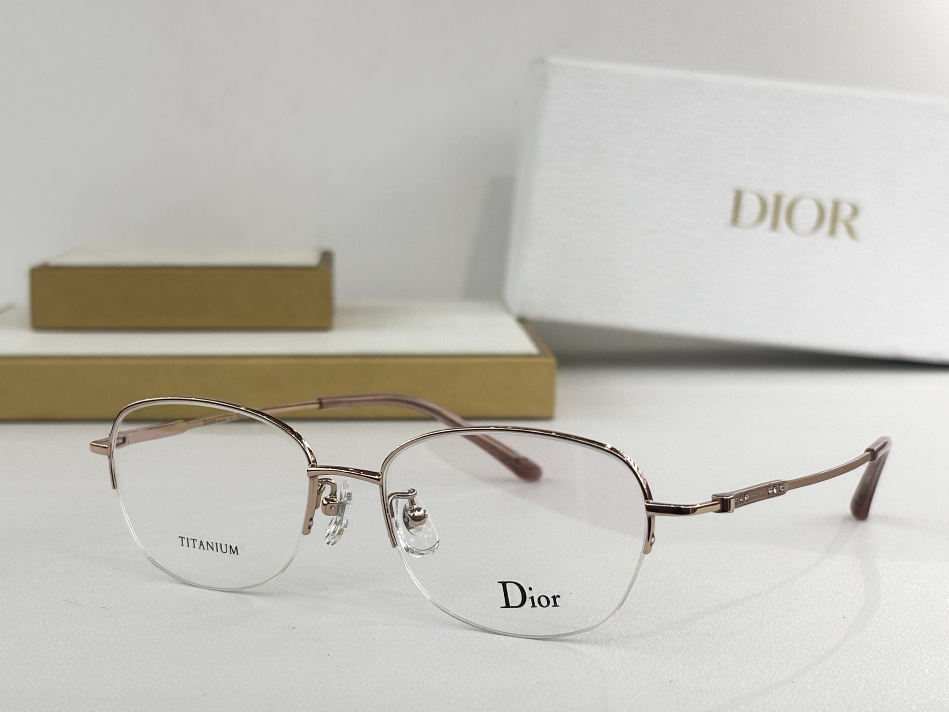 Dior Titanium Luxury Half-Rim Eyeglasses – Elegant Rose Gold