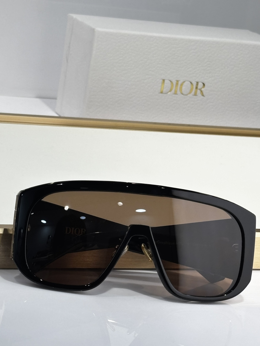 Dior Black Shield Sunglasses – Brown Lens, Gold Detail