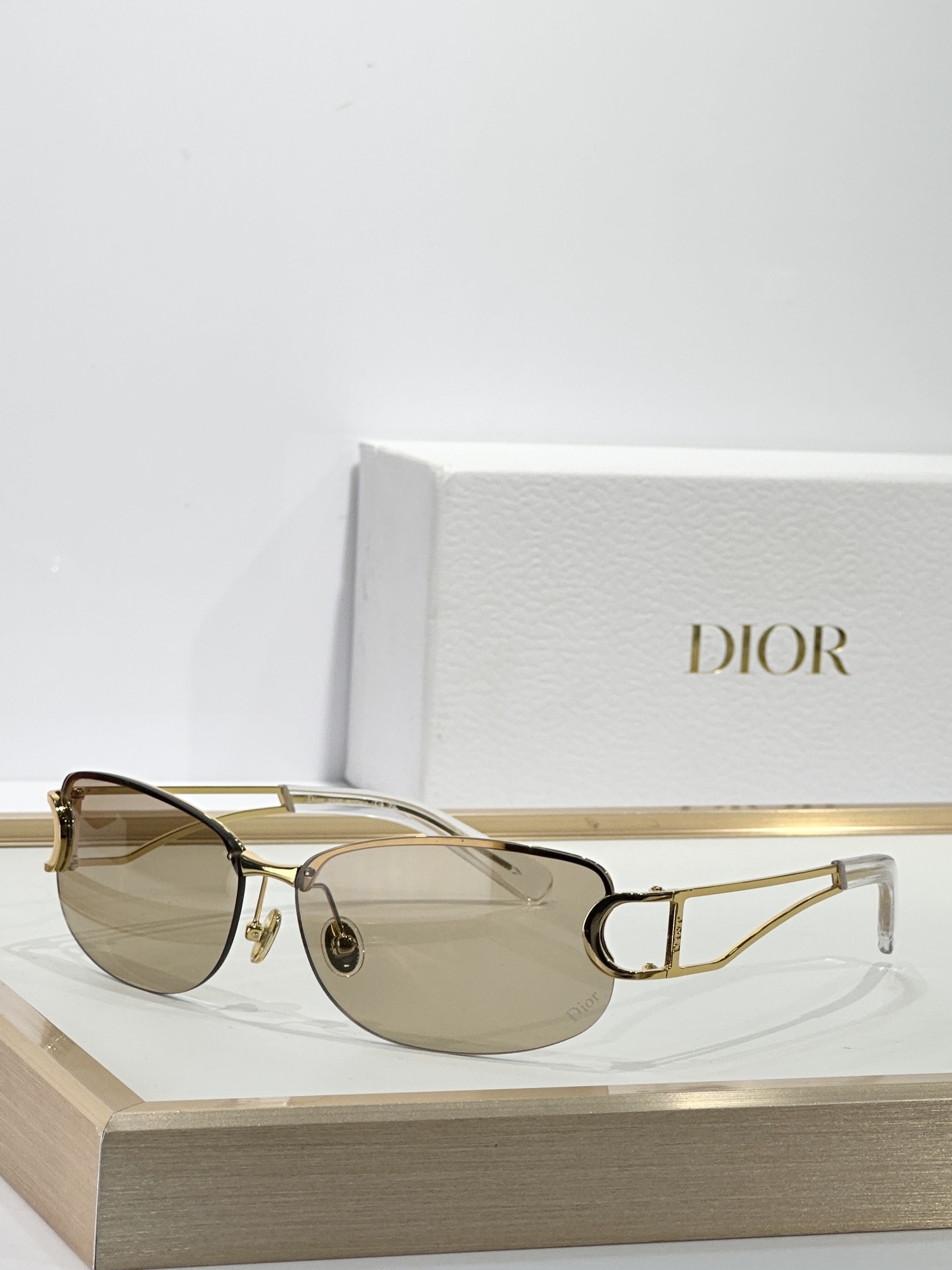 Dior Luxury Rimless Sunglasses – Gold Frame & Brown Lenses
