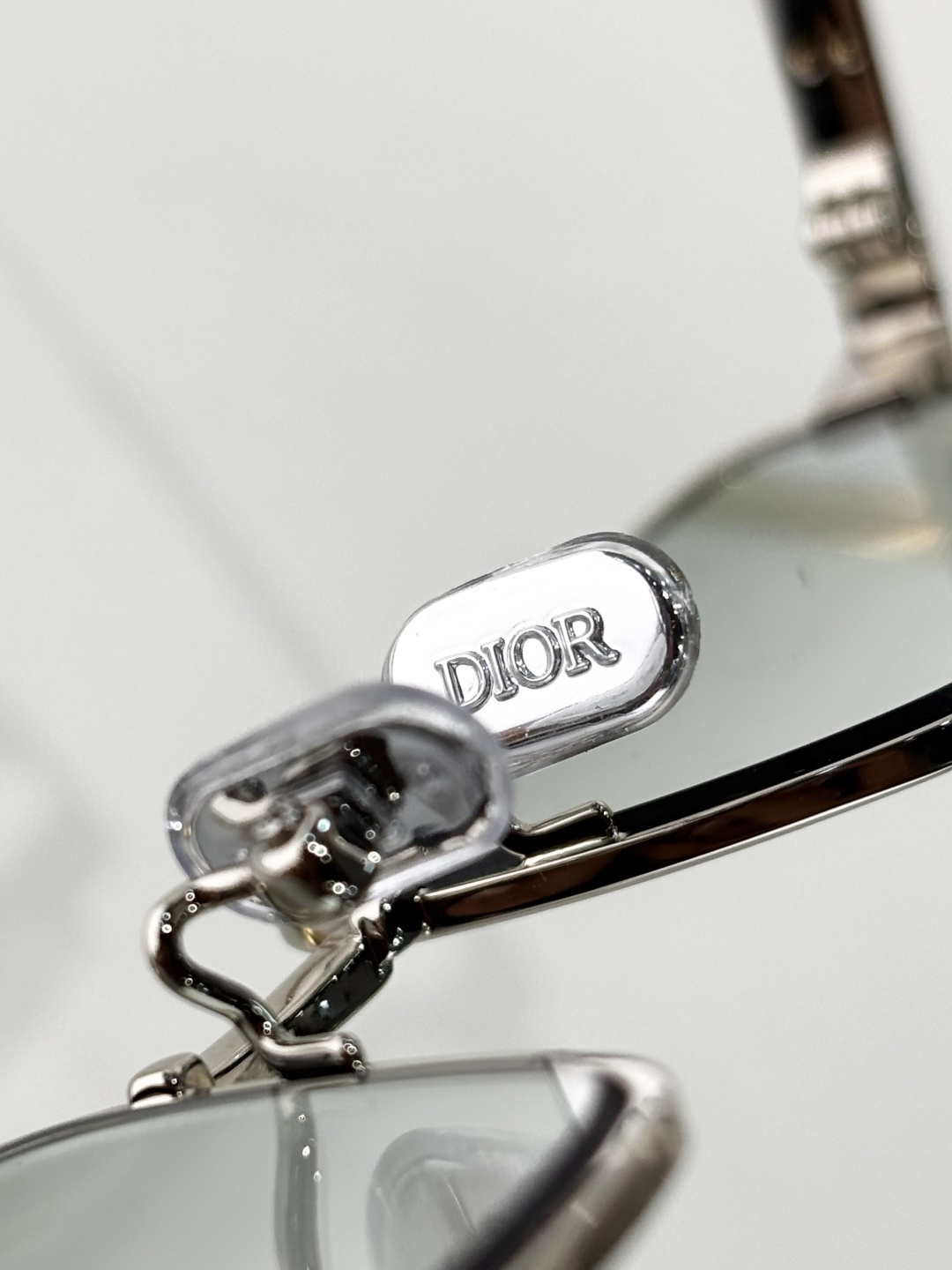 Dior Silver Rectangular Glasses with Light Green Lenses