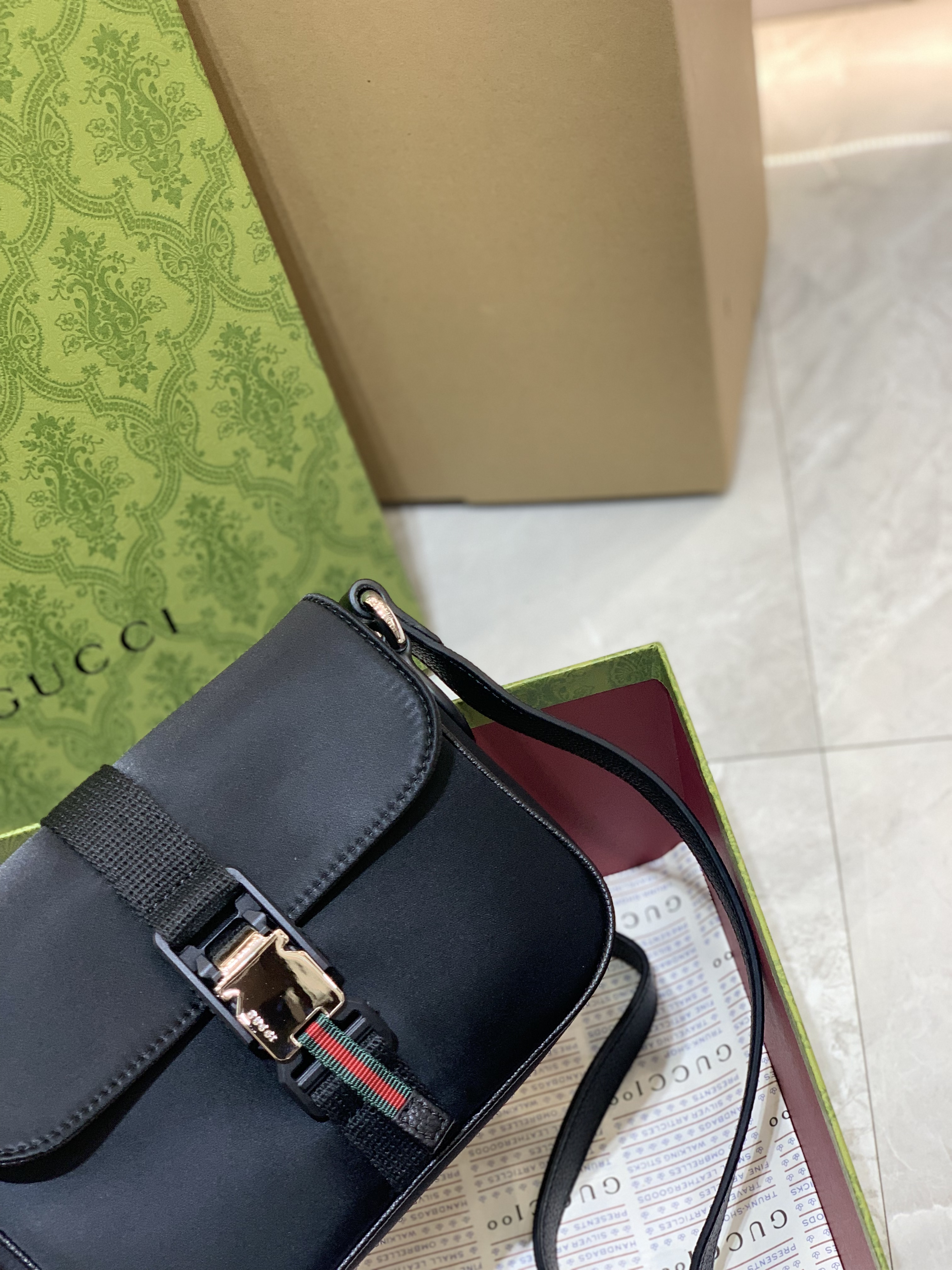 Gucci Black Leather Mini Shoulder Bag with iconic piston clasp and green-red stripe detail